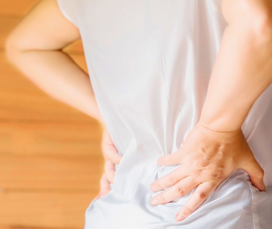 woman-s-hand-he-is-caught-waist-her-back SOLUTIONS FOR BACK PAIN
